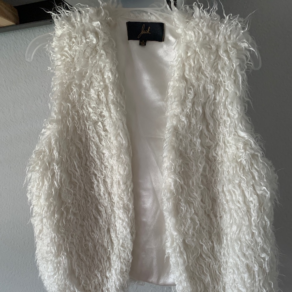 White faux fur vest by Jack.